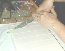 Cutting the soap into bars.